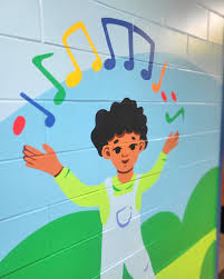 Colorful mural of a child surrounded by musical notes
