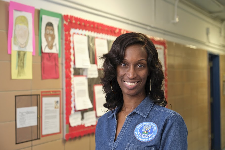 PS 262 staff member Ms. Sutton smiling in school hallway