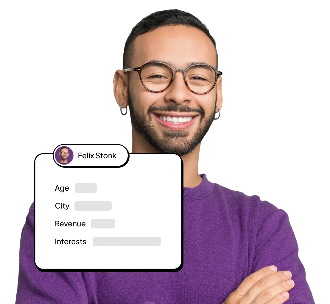 a man wearing glasses and smiling to the camera
