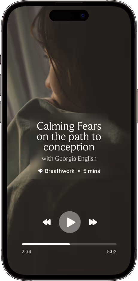 Smartphone screen showing a breathwork audio session titled 'Calming Fears on the path to conception' with Georgia English, with playback controls and a progress bar.