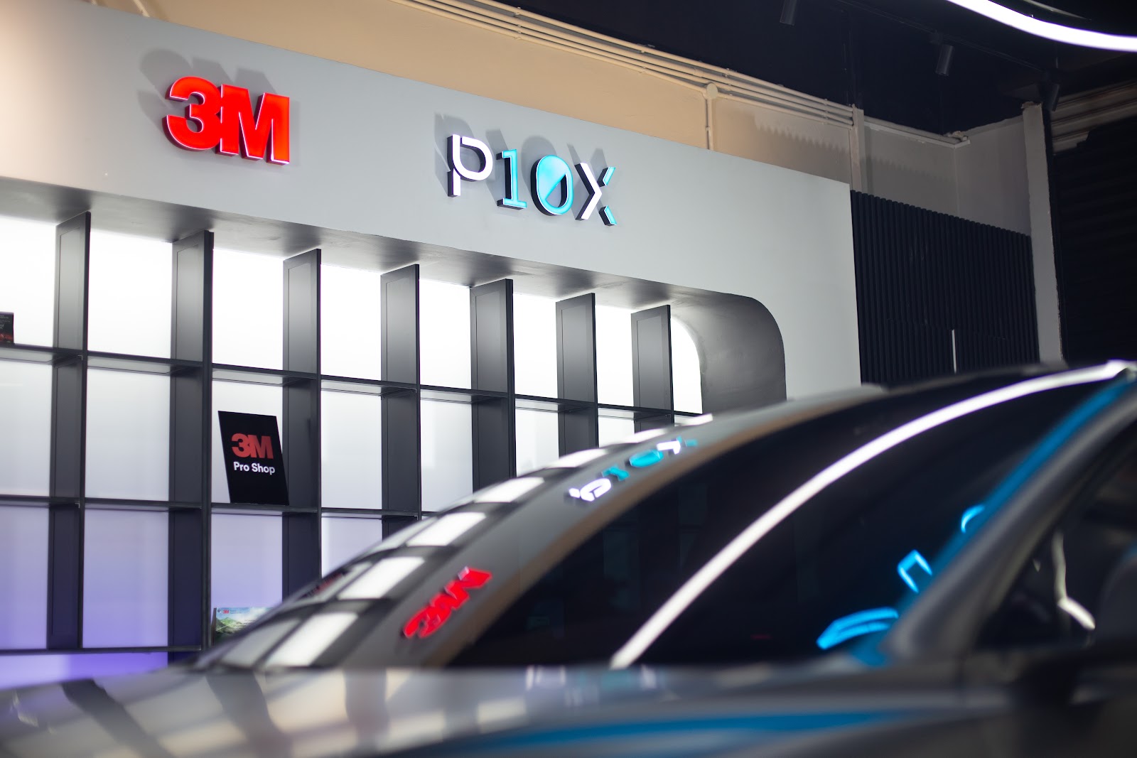 Finished window tint on a windscreen reflecting 3M Pro Shop branding, the result a full installation appointment is meant to deliver.