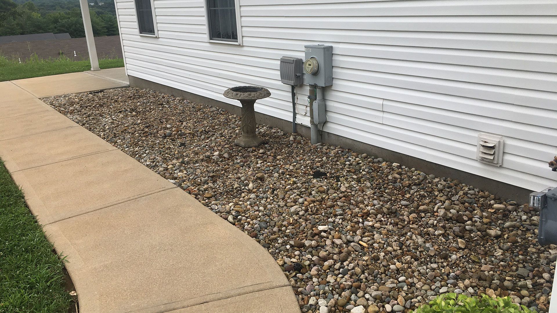 Backyard landscaping project by Village Grass Lawn Care