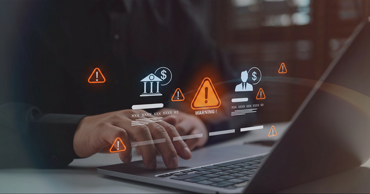 ALT TEXT: A leasing professional reviewing applicant verification results with clear fraud and identity signals.