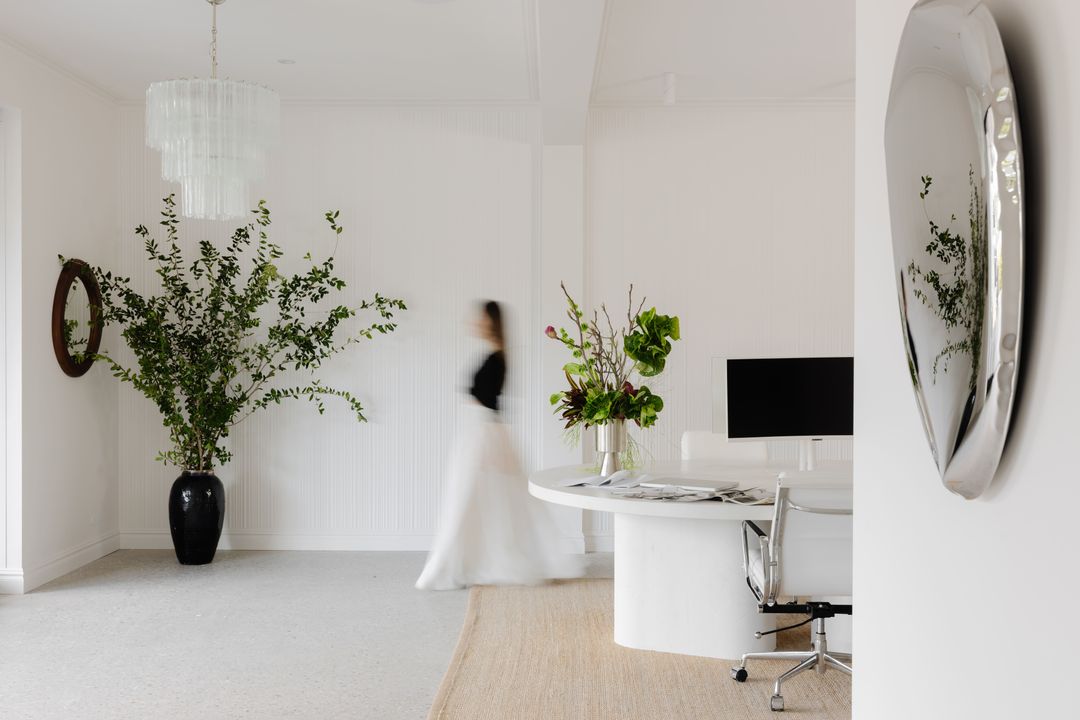The Pearl Interiors design studio in Noosa Heads, with fluted joinery, natural stone and layered timber