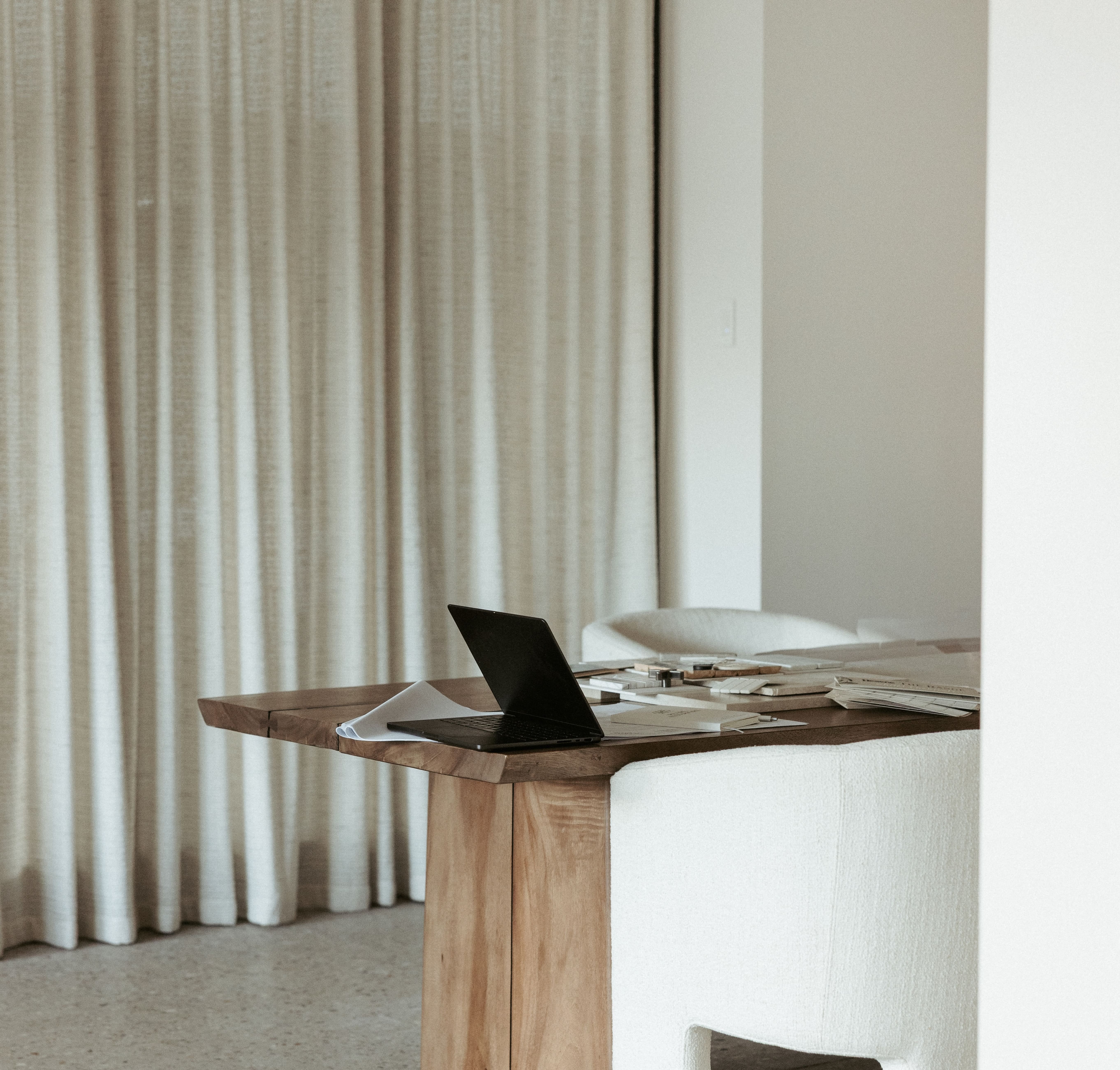 Wooden desk, black laptop