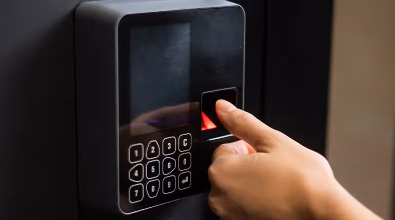 A digital door lock with a number pad and a fingerprint scanner, which is an ideal option for sites that require high security, such as government buildings and restricted areas.