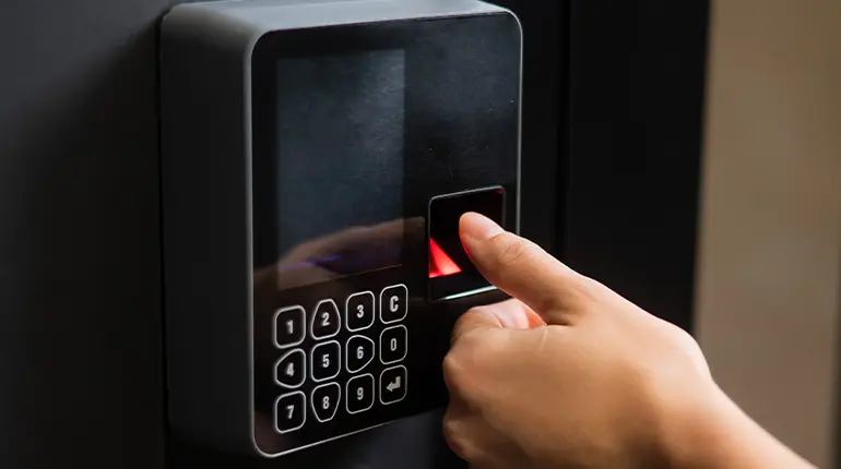 A digital door lock with a number pad and a fingerprint scanner, which is an ideal option for sites that require high security, such as government buildings and restricted areas.