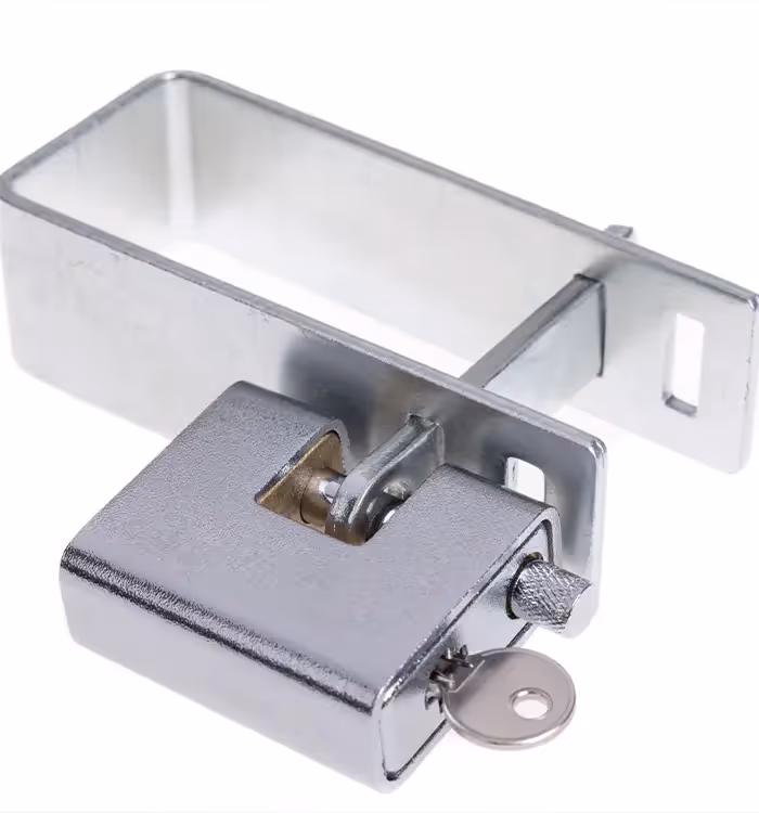 Metal security padlock with key, closed and attached to mounting bracket