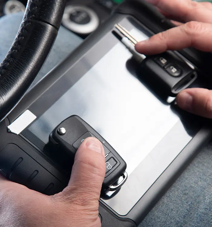 Hand adjusting car dashboard controls near steering wheel