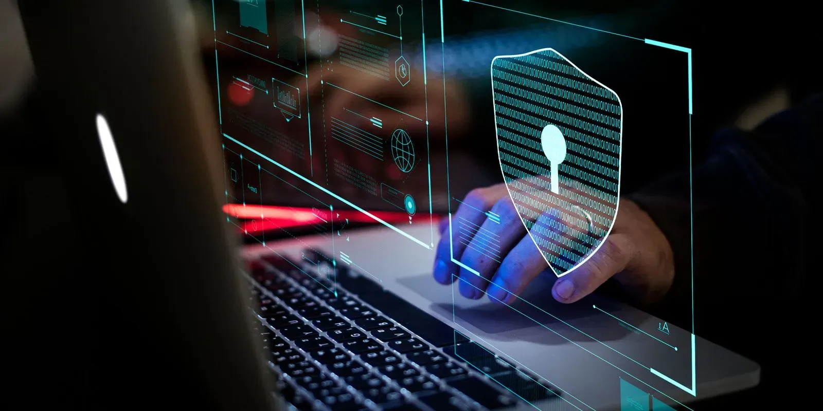 man tapping computer 