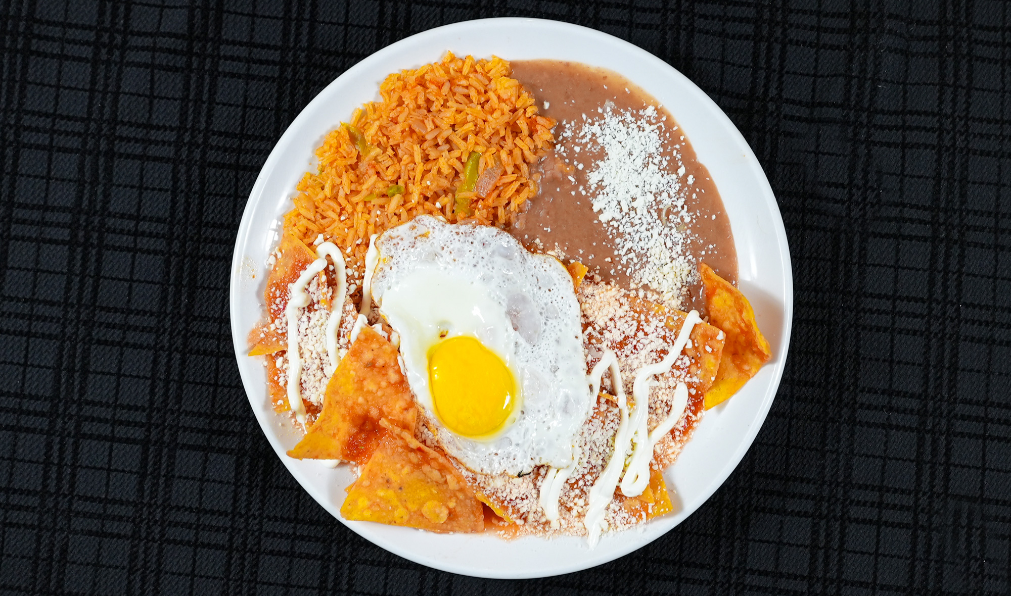 chilaquiles with egg, rice and beans