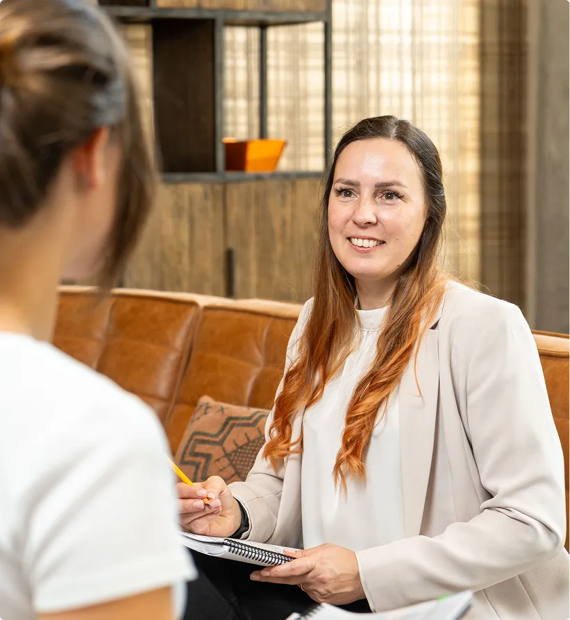 Tax Specialist Smiling and talking to a client