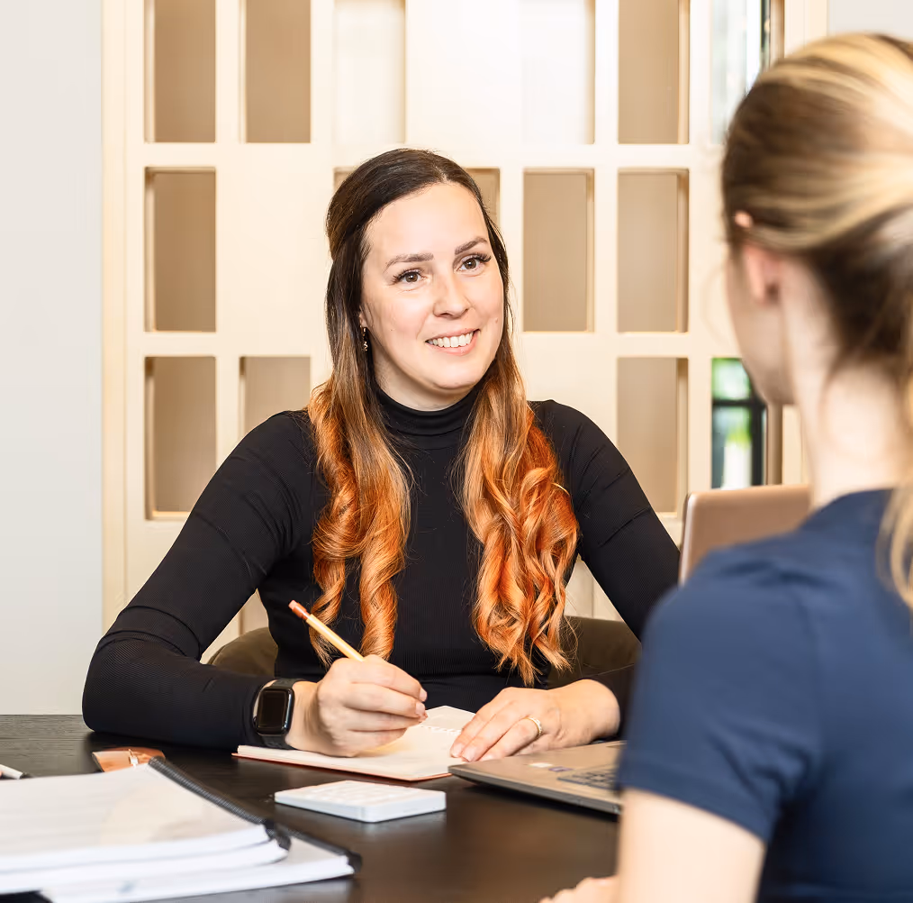 The tax specialist smiling at the client