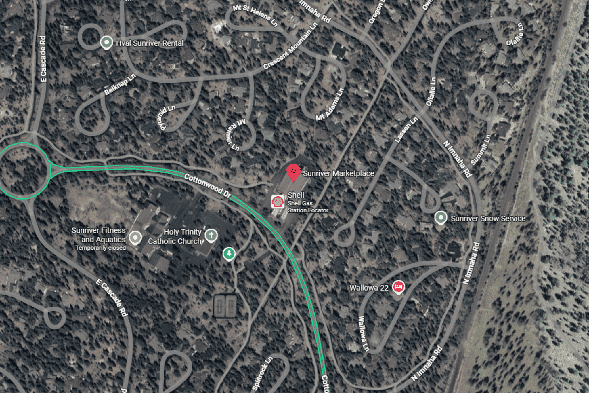 Aerial view of Sunriver area map showing roads, Shell gas station, Sunriver Marketplace, Holy Trinity Catholic Church, Sunriver Fitness and Aquatics, Sunriver Snow Service, and surrounding residential streets.