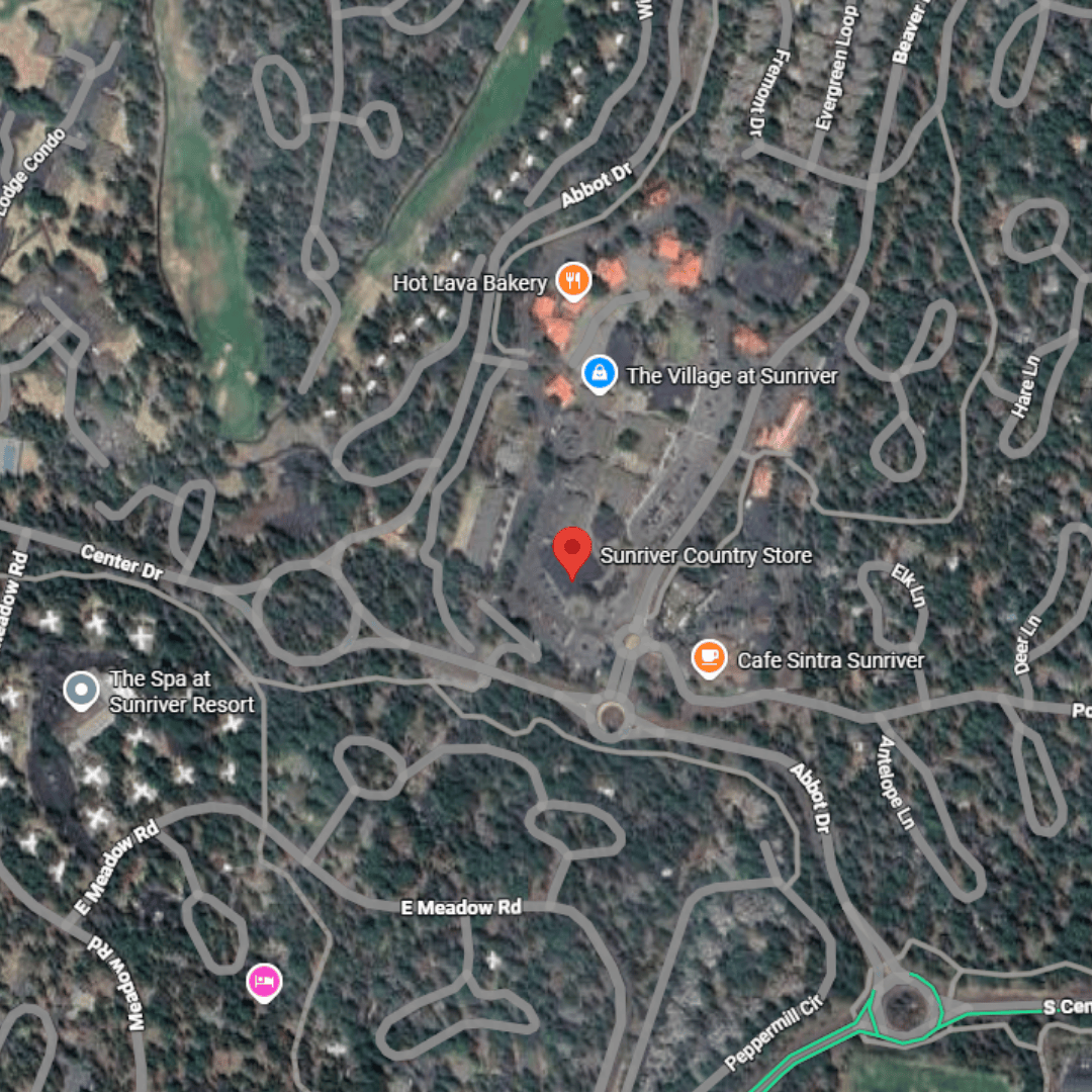 Satellite map view of Sunriver area showing road labels, businesses including Hot Lava Bakery, The Village at Sunriver, Sunriver Country Store, and Cafe Sintra Sunriver.