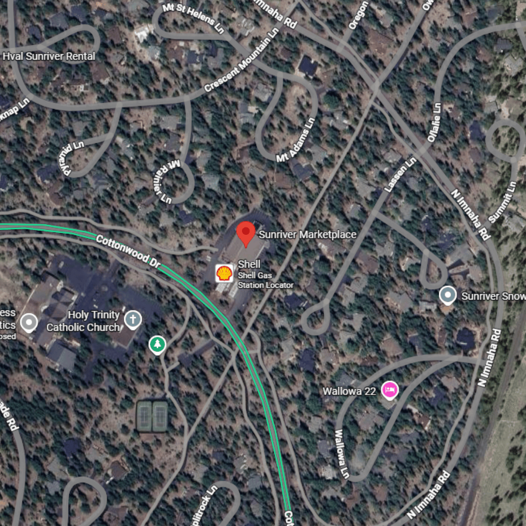 Satellite map showing roads and buildings around Sunriver Marketplace, including the Shell gas station and Holy Trinity Catholic Church in a wooded area.
