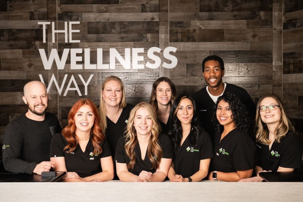 A team of smiling healthcare professionals at The Wellness Way