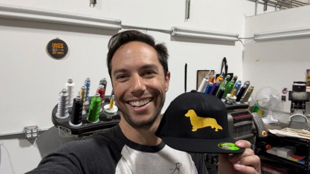 Alex Ramon holding a cap