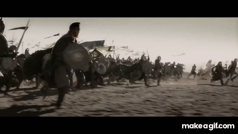GIF of a large-scale battlefield charge with soldiers running toward each other.
