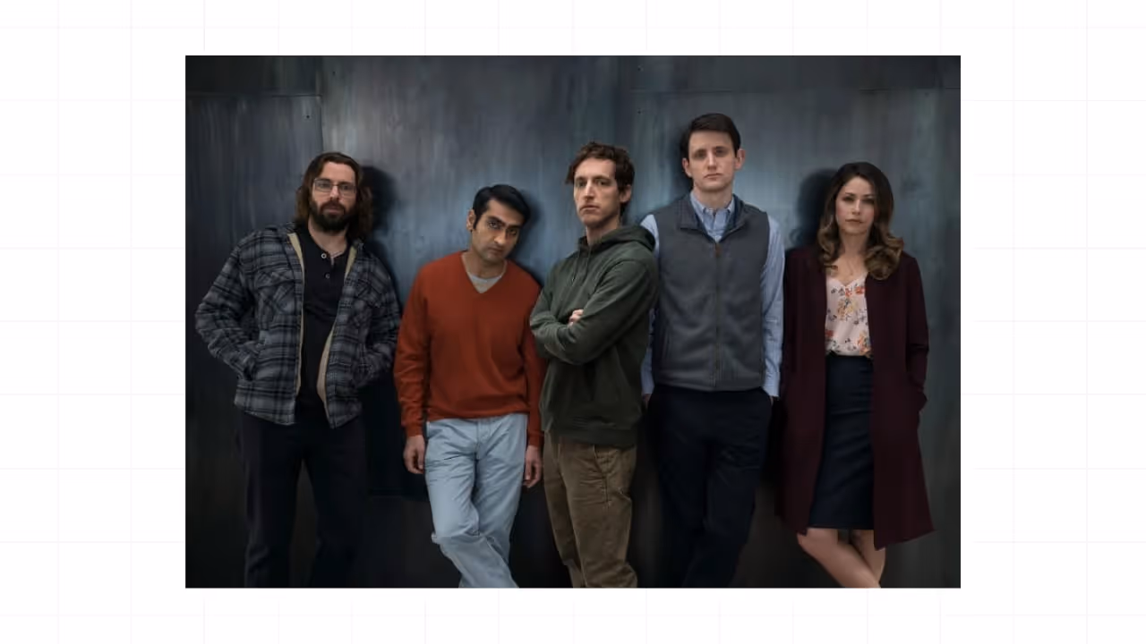 Promotional image of the five main characters from the TV show Silicon Valley standing side by side against a dark backdrop.