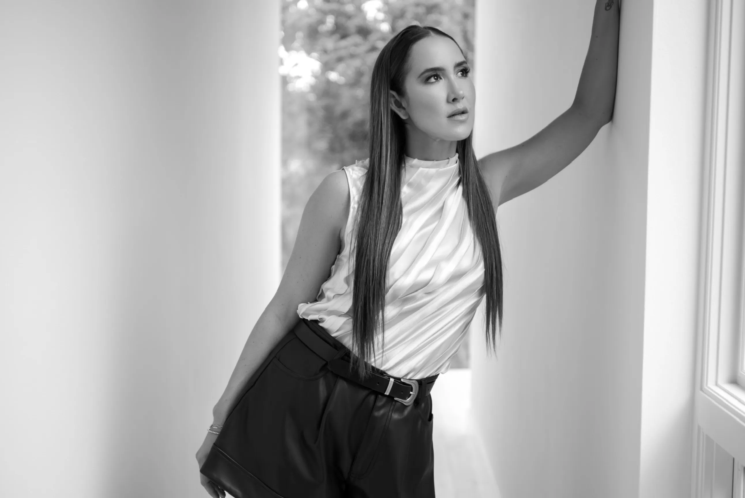 Codie sanchez black and white photo in front of window