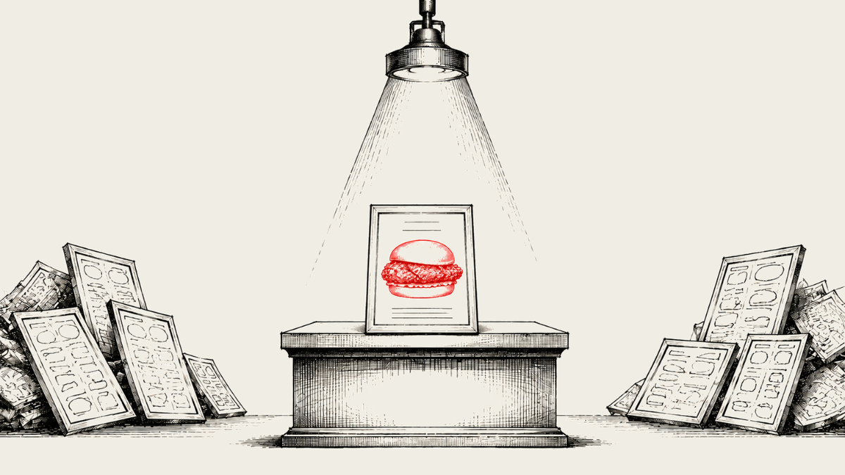 Chicken sandwich highlighted on a pedestal under a spotlight with menus stacked on both sides.