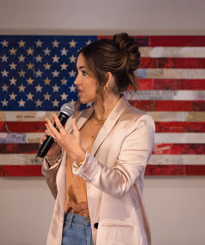 codie sanchez speaking at a contrarian thinking workshop