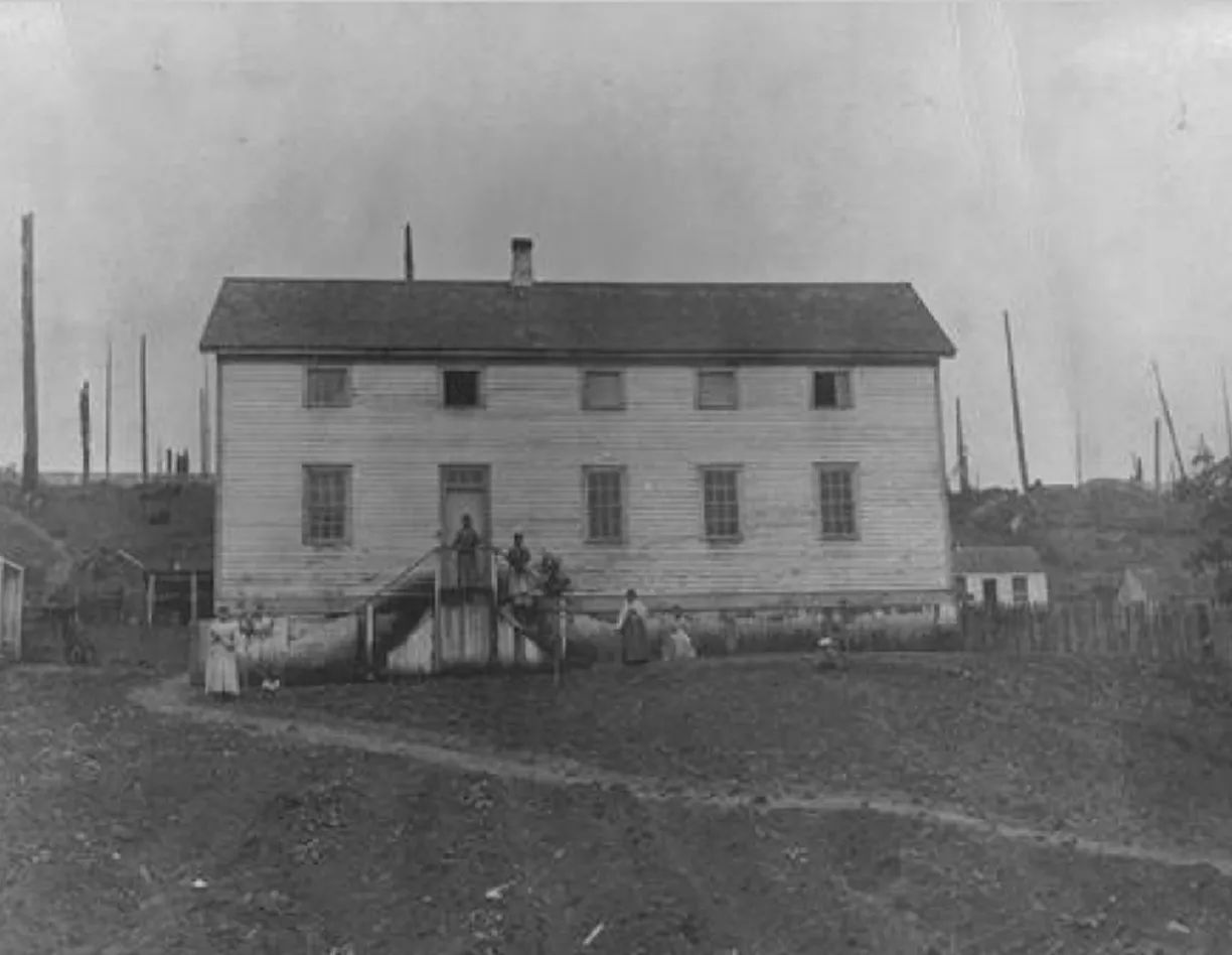 An old black and white photo of a house.