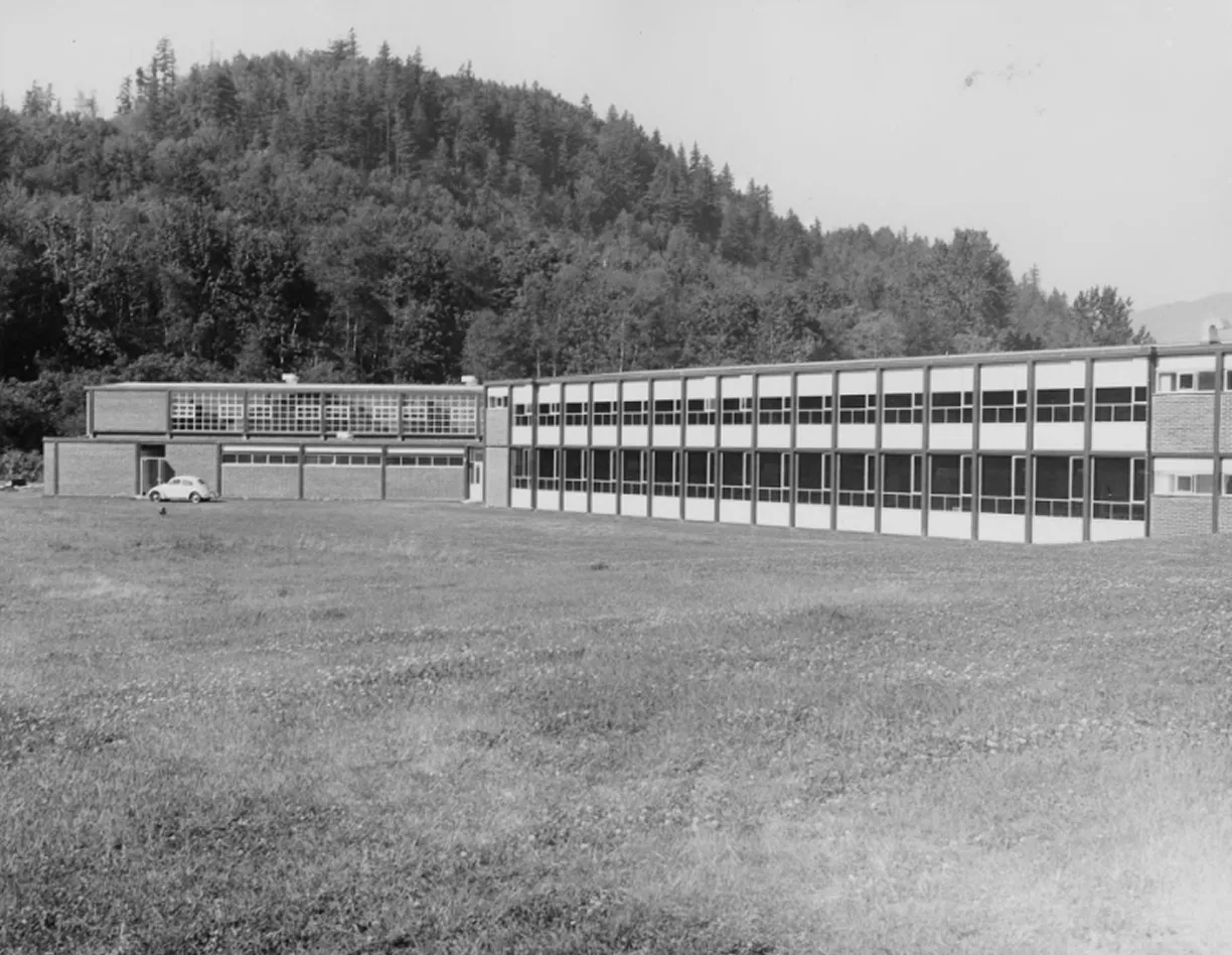 A black and white photo of a school building.