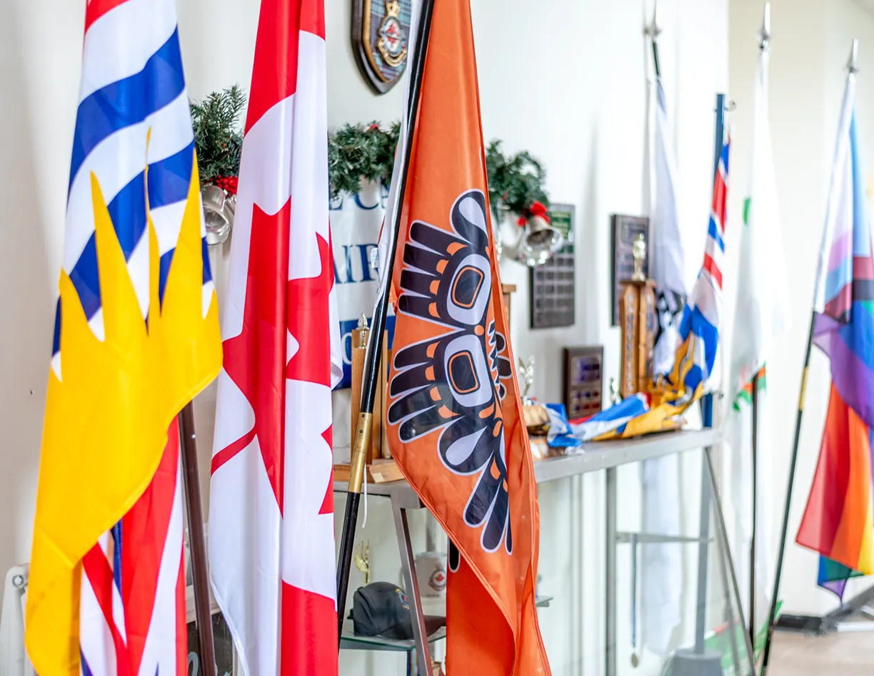 A room filled with lots of flags hanging from the ceiling.