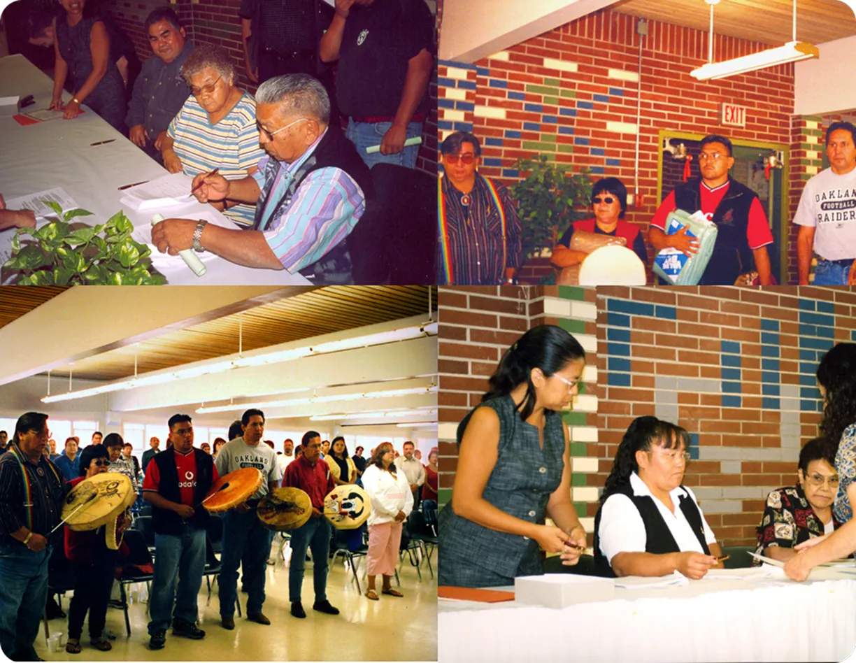 A group of people standing around a table.