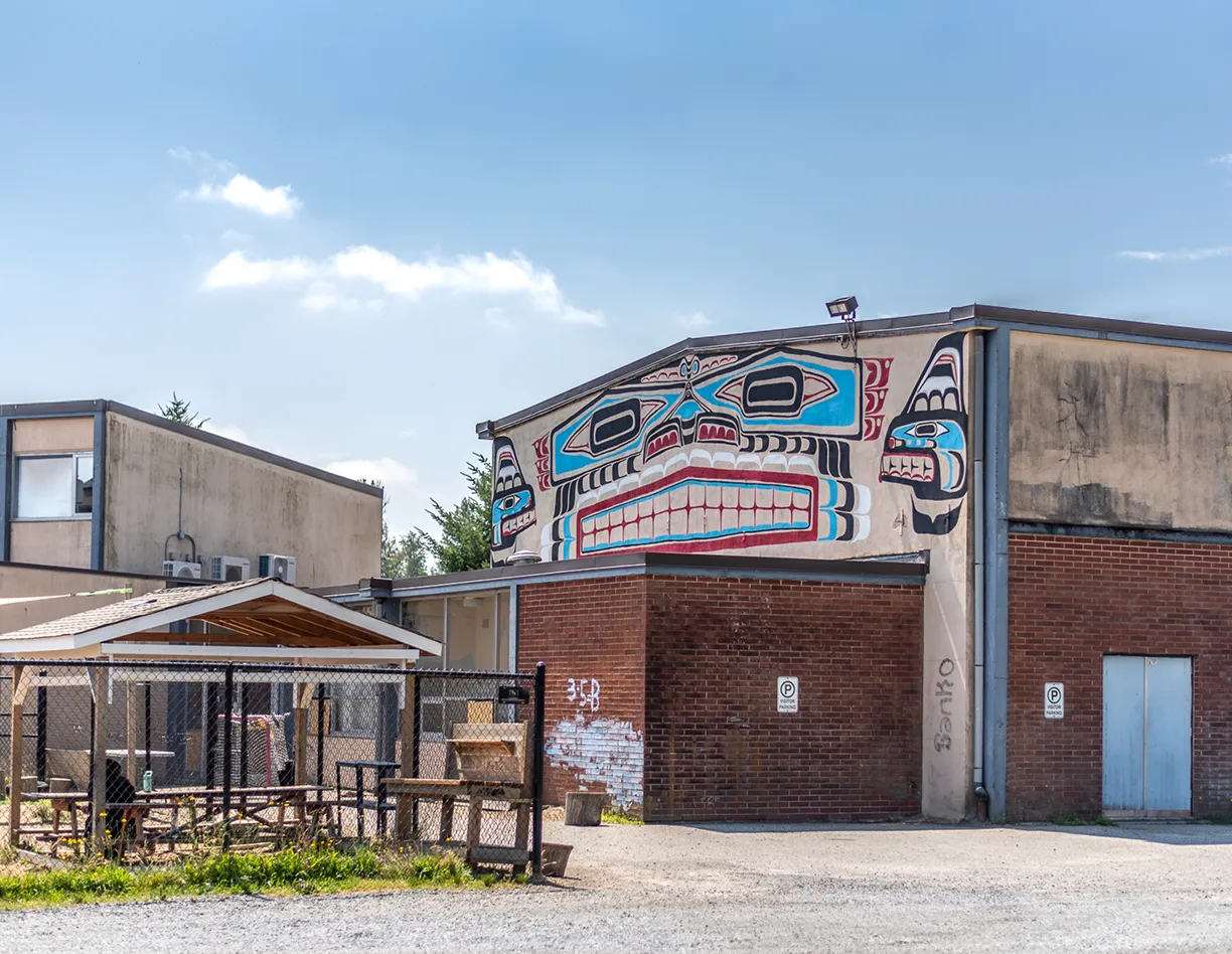 A building with a mural on the side of it.