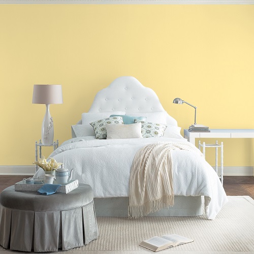 Yellow bedroom with white fabrics