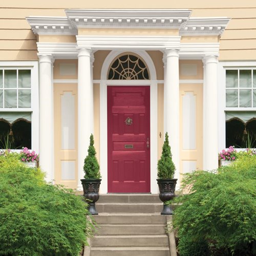 Red Magenta Front Door with Cream Exterior and White Pillars and Trim