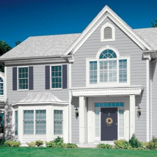 Grey exterior with "Calvary Blue" shutters