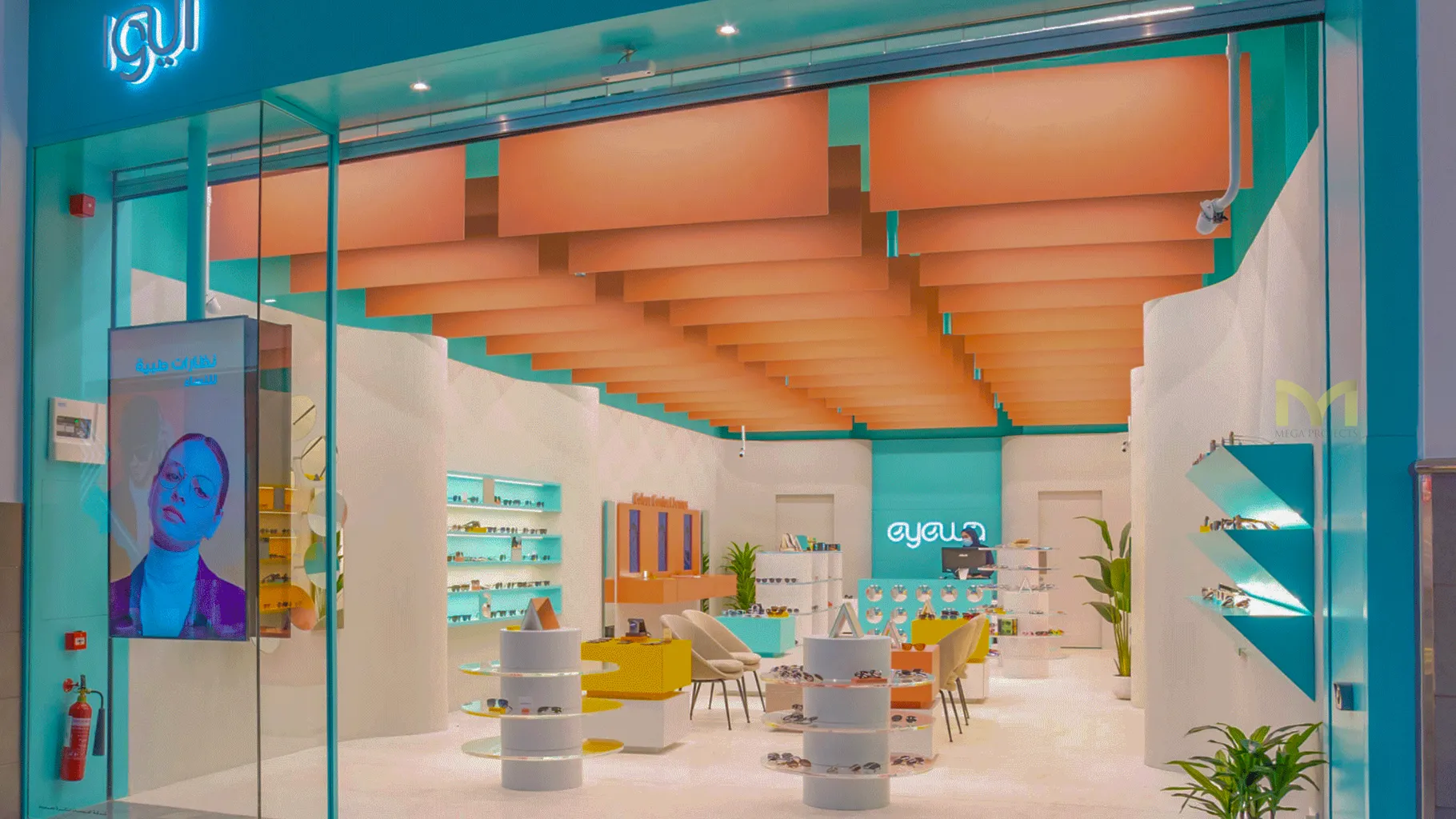 Bright eyewear store interior with modern displays and orange ceiling panels.