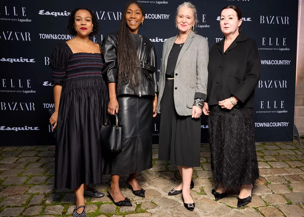 Four women pose for photo.