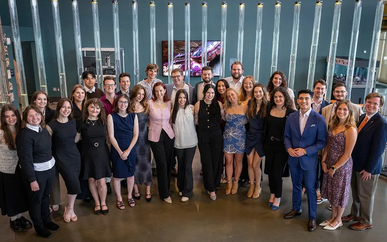 Student journalists pose for photo.