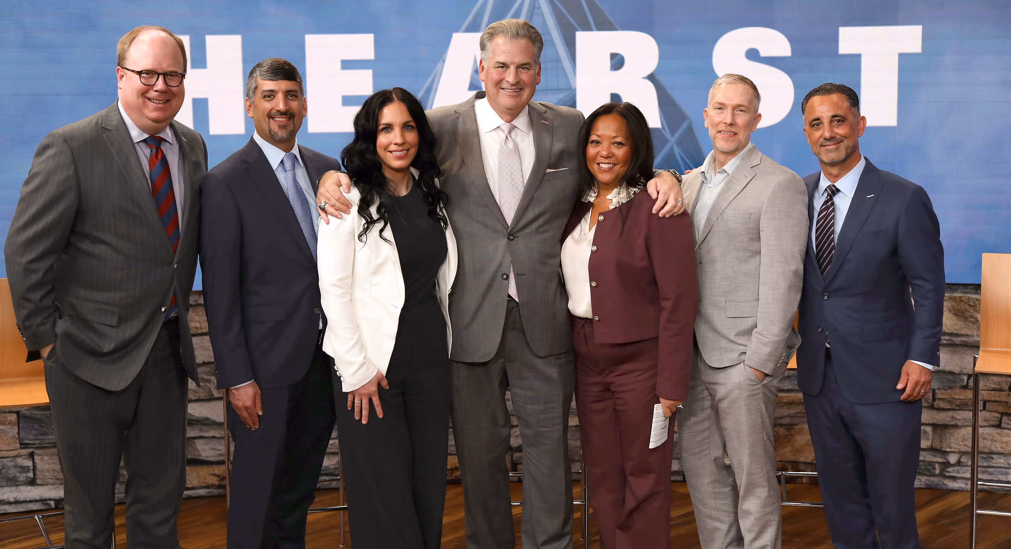 Hearst Television President Michael Hayes poses for photo alongside Hearst Television leadership. 