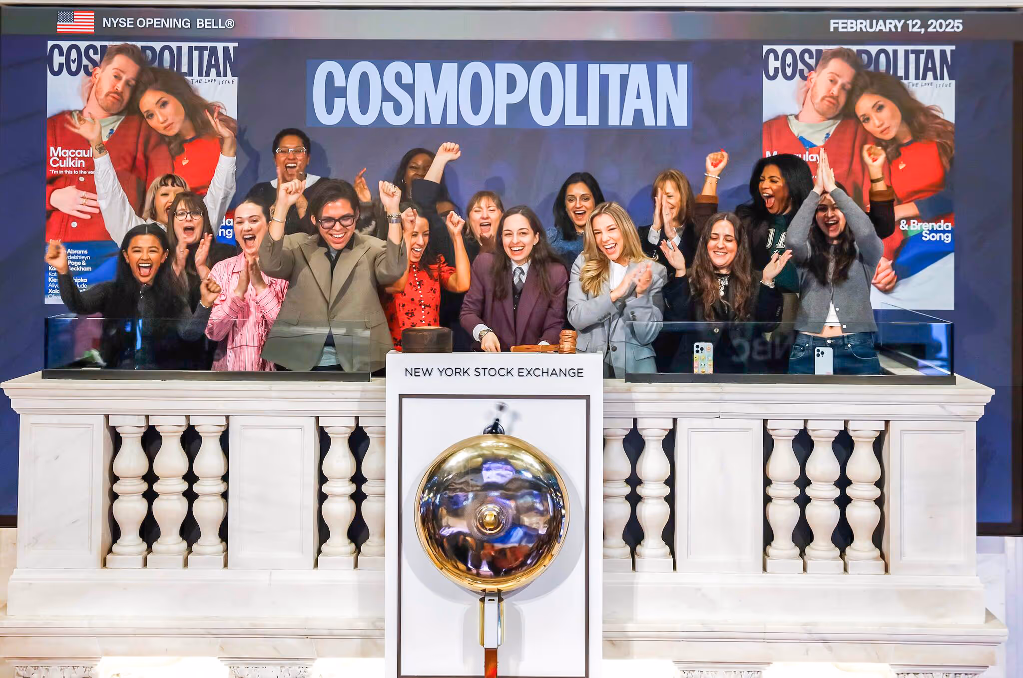 Cosmopolitan staff celebrating at the New York Stock Exchange.
