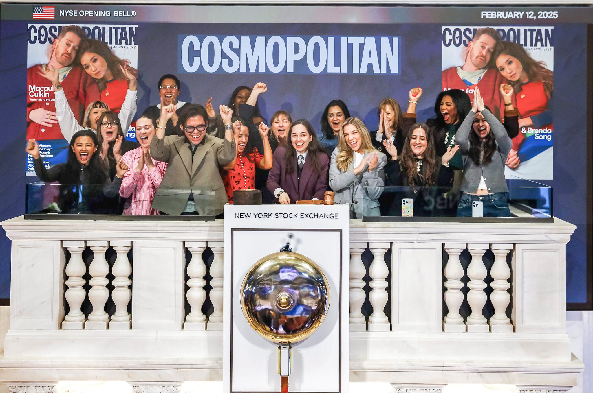 Cosmopolitan staff celebrating at the New York Stock Exchange. 