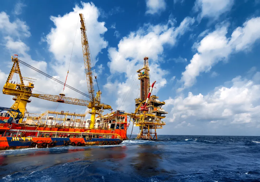 Offshore oil platform and supply vessel in the ocean