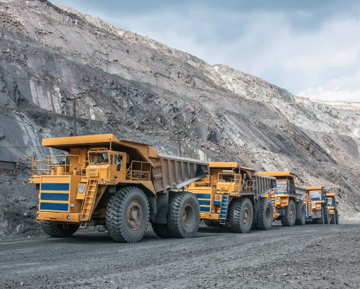 Haul trucks on a road in an open-pit mine