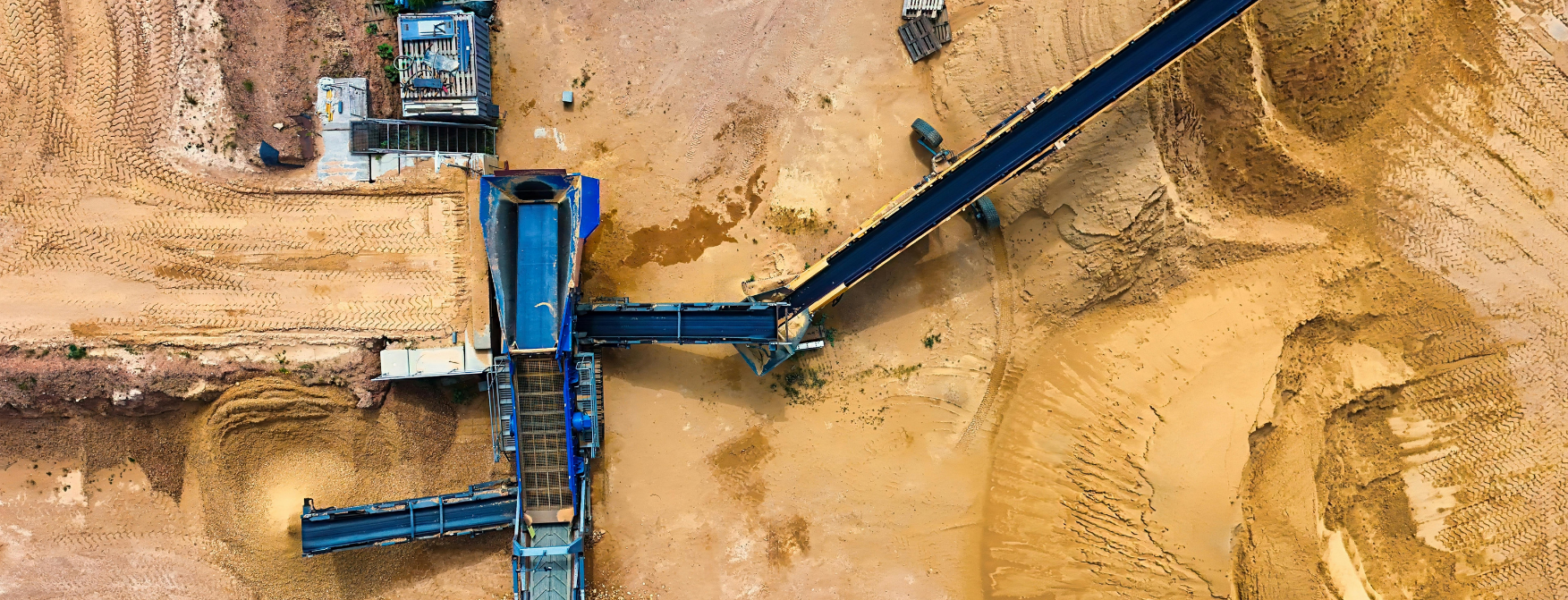 Aerial view of conveyors and processing equipment at a mine site