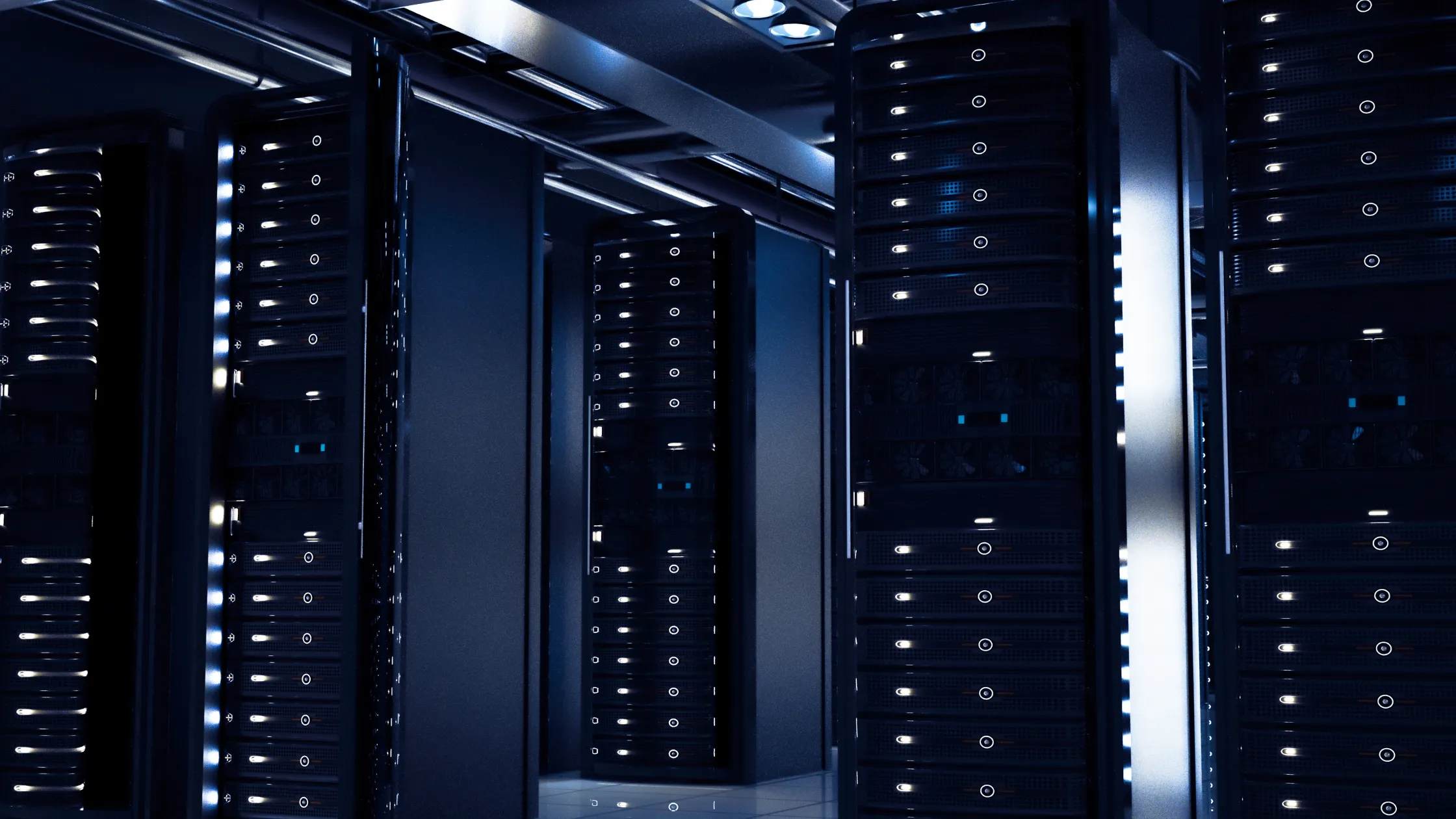 Rows of illuminated server racks in a data center hall