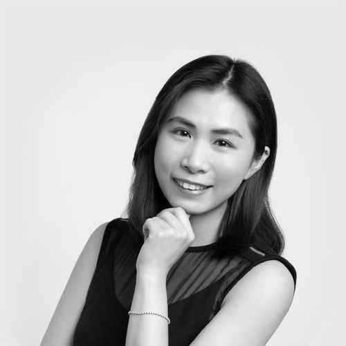 Portrait of Nigel Ko, Xtra Sensing Co-Founder. Wearing a dark suit jacket and white shirt against a plain background.