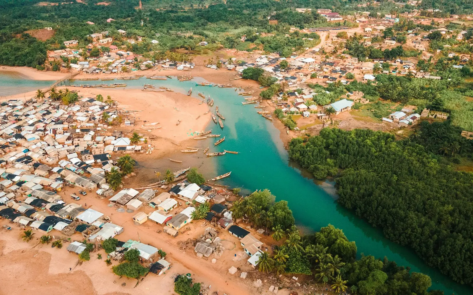 Aerial view of Akwidaa on the coast of Ghana, divided by the Ezile River