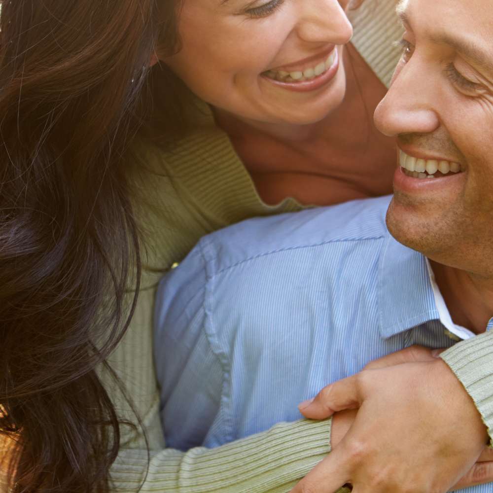 Happy couple enjoying improved energy and well-being supported by hormone wellness services at Fanous Medspa in Charlotte, NC.