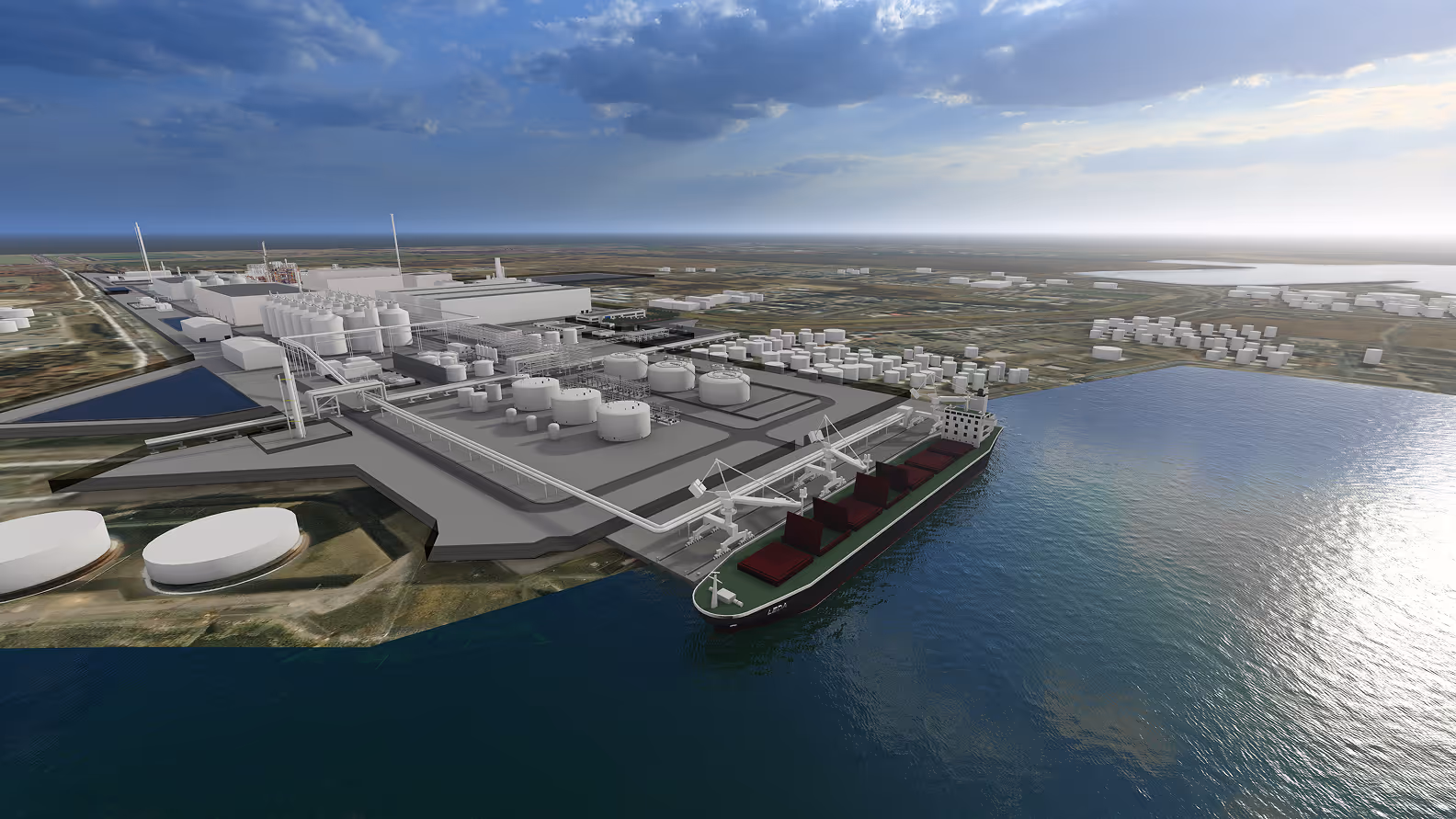 A large industrial port facility with storage tanks and a cargo ship docked at the quay under a partly cloudy sky.