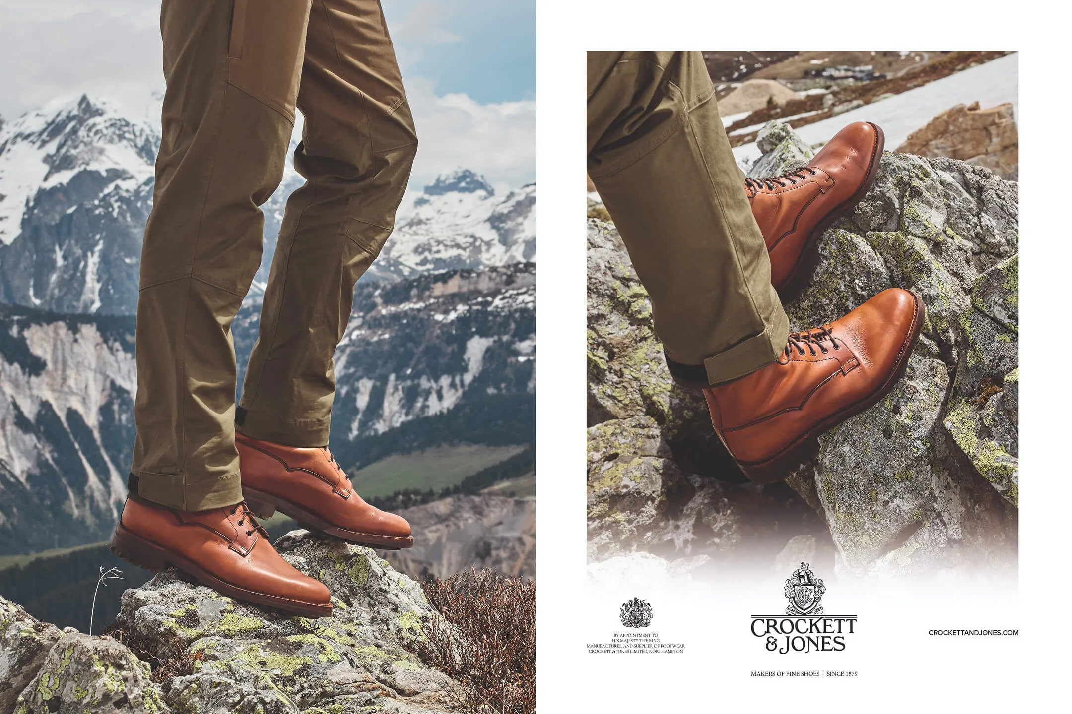 Close-up of a person wearing brown leather boots and olive green pants standing on mossy rocks with snowy mountains in the background.